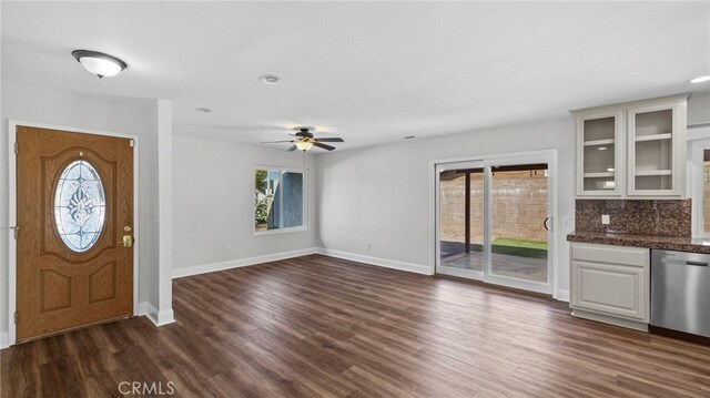 entryway featuring baseboards and plenty of natural light