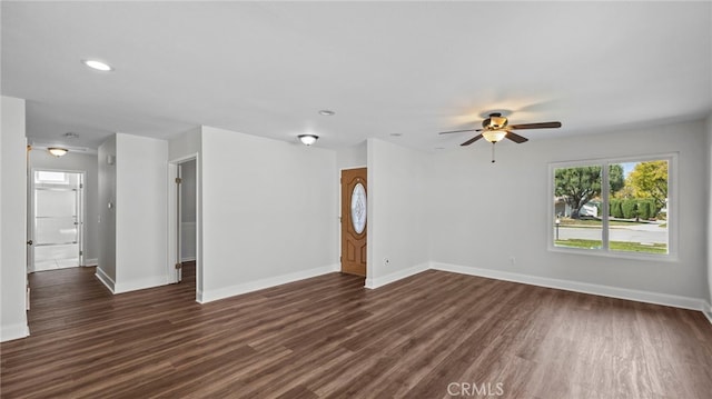 unfurnished living room with recessed lighting, baseboards, a ceiling fan, and dark wood-style flooring