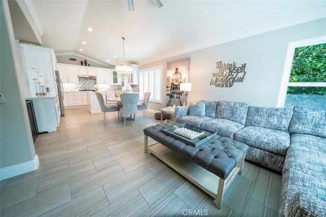 living room with recessed lighting and vaulted ceiling
