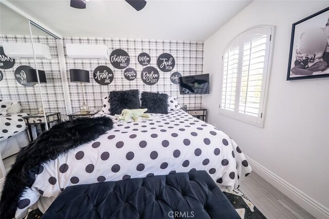 bedroom featuring baseboards and ceiling fan