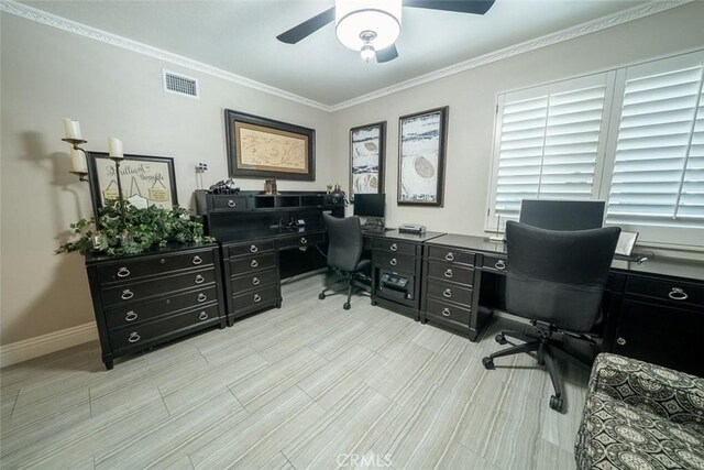 home office featuring crown molding, a ceiling fan, baseboards, and visible vents