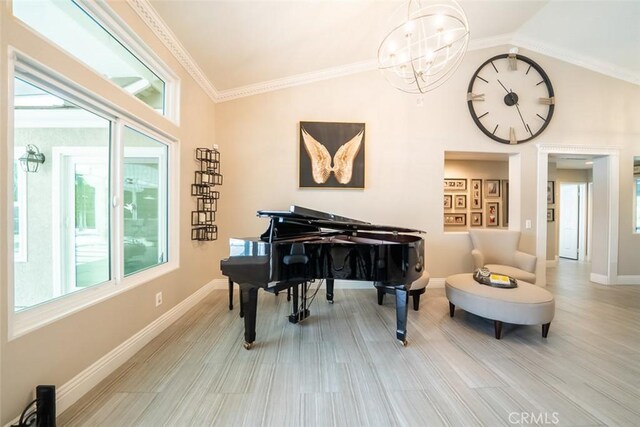 living area featuring baseboards, plenty of natural light, and lofted ceiling