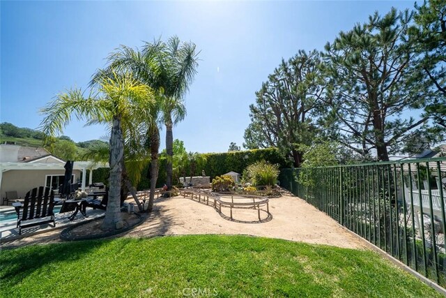 view of yard with fence and a patio area