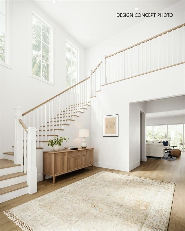 927 9th St, Manhattan Beach, CA 90266 - stairway featuring wood finished floors, a high ceiling, and recessed lighting