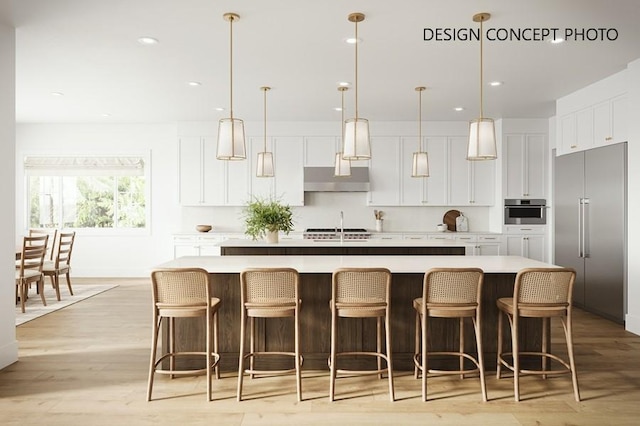 927 9th St, Manhattan Beach, CA 90266 - kitchen with stainless steel appliances, white cabinetry, a large island with sink, light countertops, and recessed lighting
