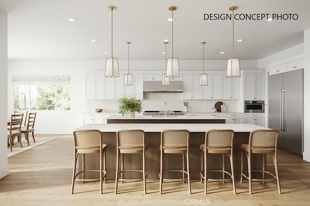 927 9th St, Manhattan Beach, CA 90266 - kitchen featuring white cabinets, appliances with stainless steel finishes, a large island, recessed lighting, and light countertops