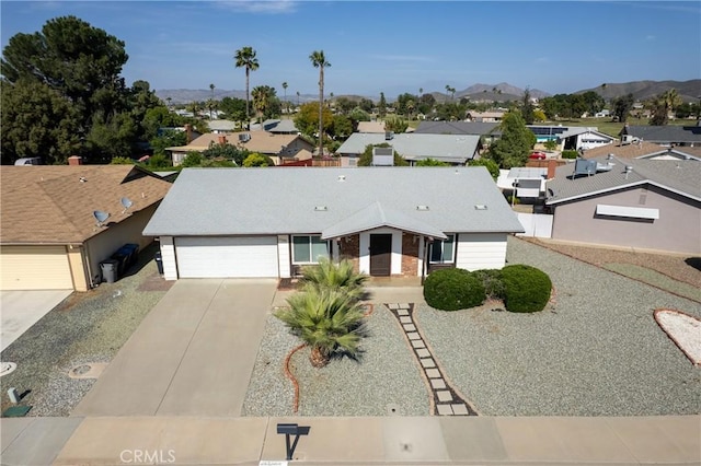 27680 Sandtrap Dr, Menifee, CA 92586 - view of front of property featuring an attached garage, a residential view, concrete driveway, and a mountain view