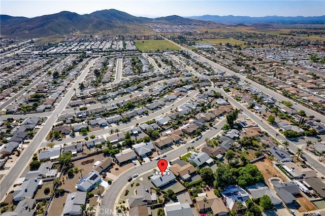 birds eye view of property featuring a mountain view