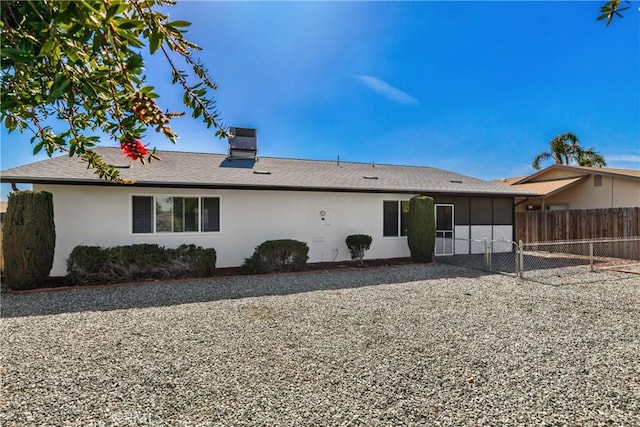27680 Sandtrap Dr, Menifee, CA 92586 - back of property featuring stucco siding, a gate, and a chimney