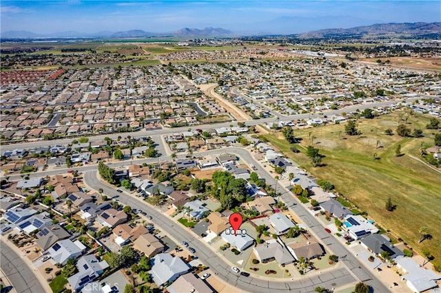 birds eye view of property featuring a mountain view and a residential view