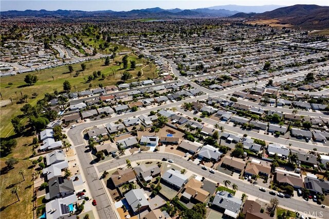 27680 Sandtrap Dr, Menifee, CA 92586 - aerial overview of property's location with a mountain backdrop and nearby suburban area