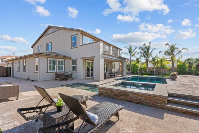 21609 Lucas Ct, Saugus, CA 91390 - rear view of property featuring a fenced in pool, an in ground hot tub, and a patio area