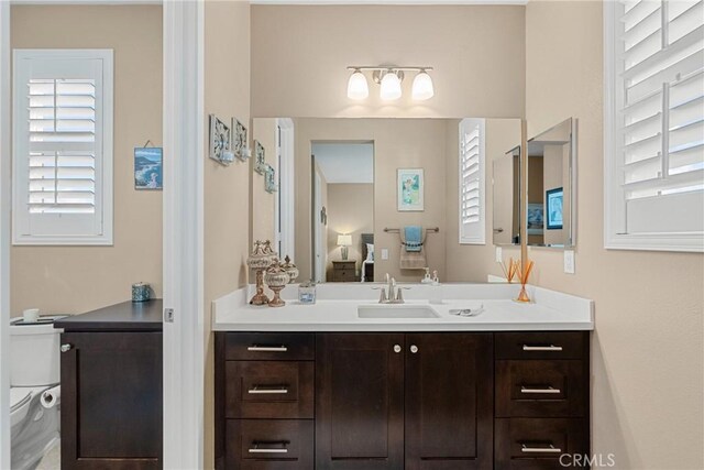 21609 Lucas Ct, Saugus, CA 91390 - ensuite bathroom with vanity, ensuite bathroom, toilet, and a wealth of natural light