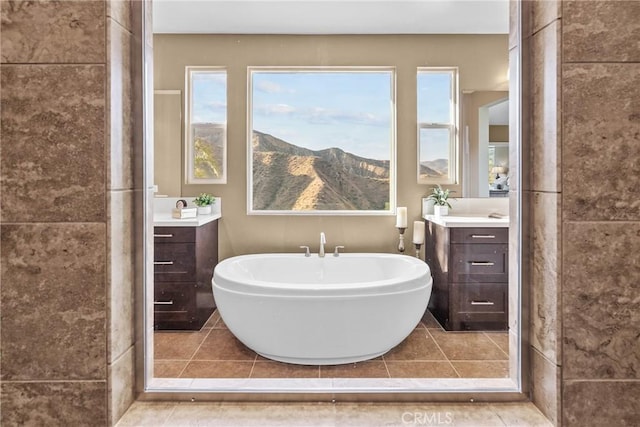 21609 Lucas Ct, Saugus, CA 91390 - full bath featuring a freestanding tub, plenty of natural light, tile patterned floors, and vanity
