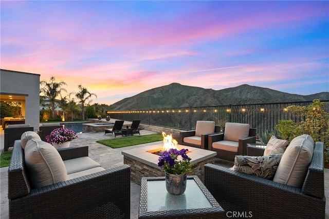 21609 Lucas Ct, Saugus, CA 91390 - view of patio / terrace with an outdoor living space with a fire pit and a mountain view
