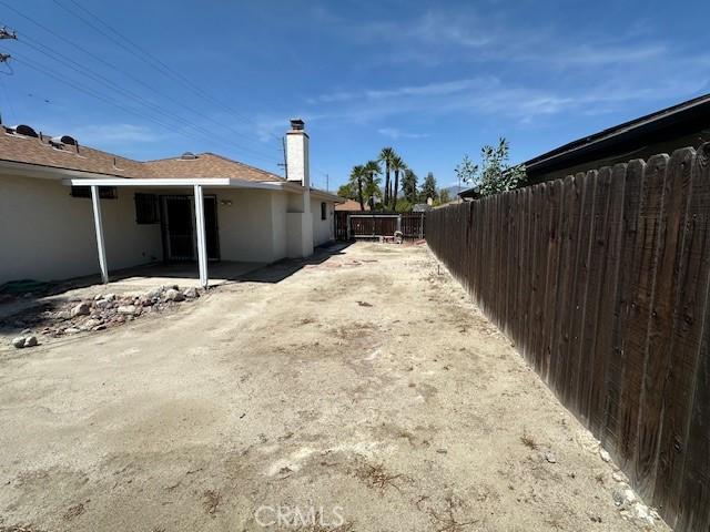 view of yard with fence and a patio area