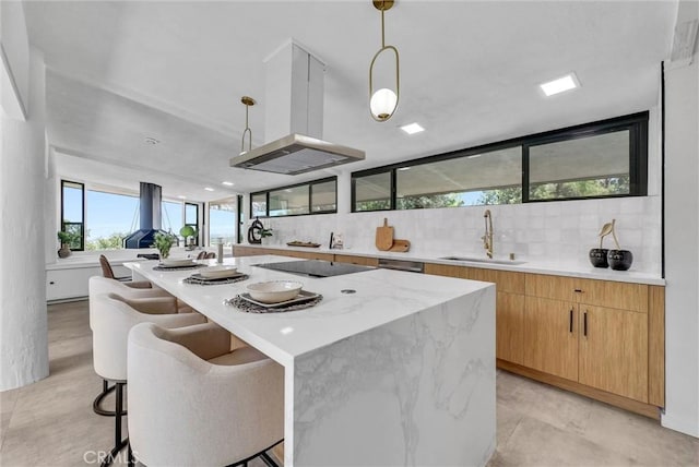 15495 Washington St, Riverside, CA 92506 - kitchen featuring black electric stovetop, a kitchen island, island exhaust hood, a sink, and modern cabinets