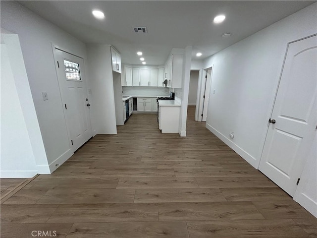 kitchen with visible vents, wood finished floors, and recessed lighting