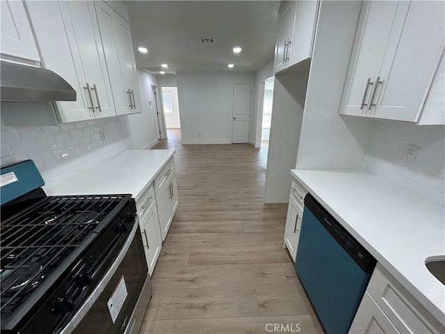 kitchen with gas range, under cabinet range hood, light countertops, dishwasher, and visible vents