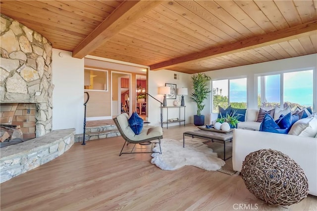 2978 Crownview Dr, Rancho Palos Verdes, CA 90275 - living room with a wooden ceiling with exposed beams, wood finished floors, and a stone fireplace