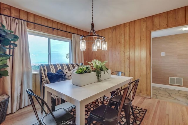 2978 Crownview Dr, Rancho Palos Verdes, CA 90275 - dining room with light wood-style flooring and wood walls