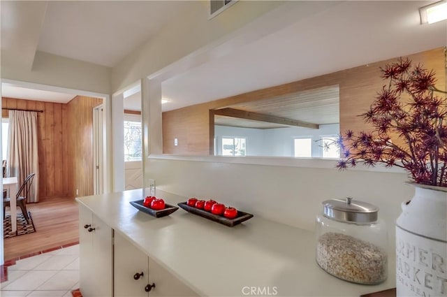 2978 Crownview Dr, Rancho Palos Verdes, CA 90275 - kitchen featuring light tile patterned flooring, light countertops, and white cabinetry