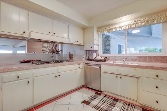 2978 Crownview Dr, Rancho Palos Verdes, CA 90275 - kitchen featuring appliances with stainless steel finishes, under cabinet range hood, light countertops, light tile patterned floors, and white cabinets