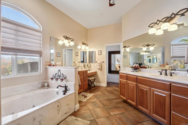 25444 Rancho Barona Rd, Ramona, CA 92065 - bathroom featuring a tub with jets, vanity, baseboards, and a towering ceiling