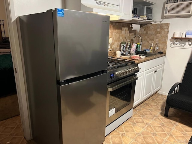 25444 Rancho Barona Rd, Ramona, CA 92065 - kitchen with stainless steel appliances, white cabinetry, backsplash, under cabinet range hood, and light tile patterned flooring
