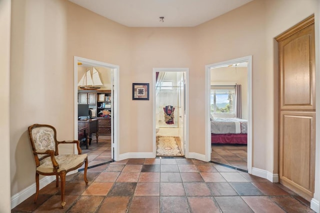 25444 Rancho Barona Rd, Ramona, CA 92065 - corridor featuring a desk and baseboards