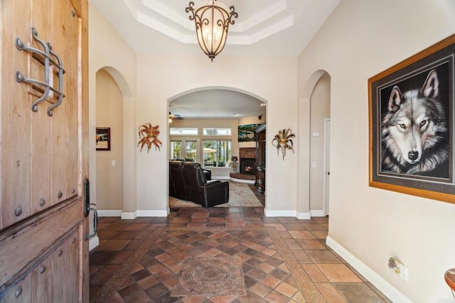 25444 Rancho Barona Rd, Ramona, CA 92065 - foyer with stone tile floors, arched walkways, and inlaid floor details