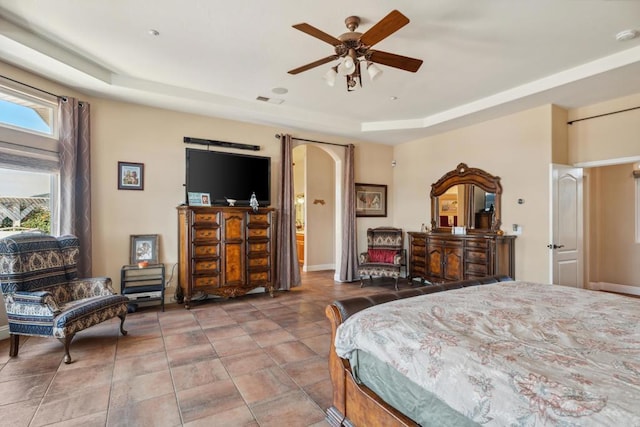25444 Rancho Barona Rd, Ramona, CA 92065 - bedroom featuring a tray ceiling, arched walkways, baseboards, and a ceiling fan