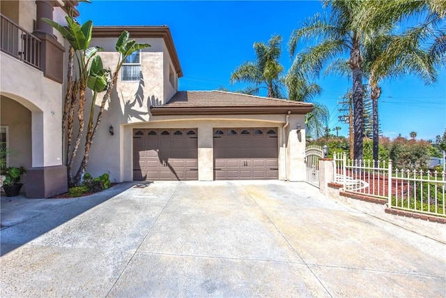 652 Fairway Dr, Redlands, CA 92373 - view of front facade featuring stucco siding, concrete driveway, fence, and a tile roof