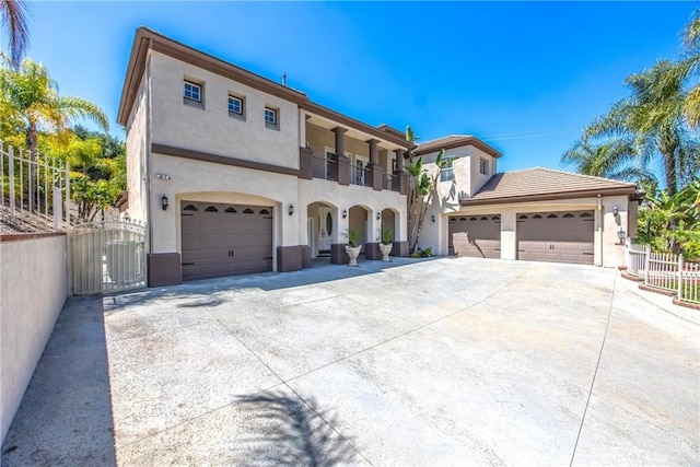 652 Fairway Dr, Redlands, CA 92373 - mediterranean / spanish house with stucco siding, driveway, a gate, fence, and a balcony