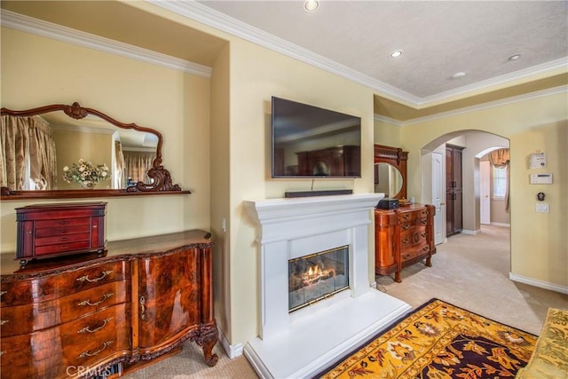 652 Fairway Dr, Redlands, CA 92373 - carpeted living area with arched walkways, crown molding, a glass covered fireplace, baseboards, and recessed lighting