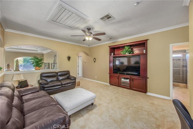 652 Fairway Dr, Redlands, CA 92373 - living room featuring light carpet, arched walkways, a ceiling fan, ornamental molding, and baseboards