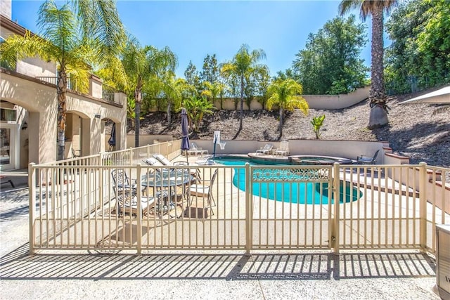 652 Fairway Dr, Redlands, CA 92373 - view of pool with an in-ground hot tub, a patio, and fence