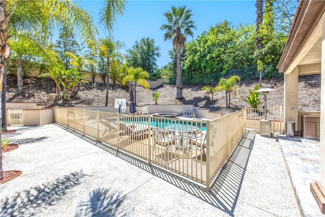 652 Fairway Dr, Redlands, CA 92373 - view of swimming pool featuring a fenced backyard, an in-ground hot tub, and a patio