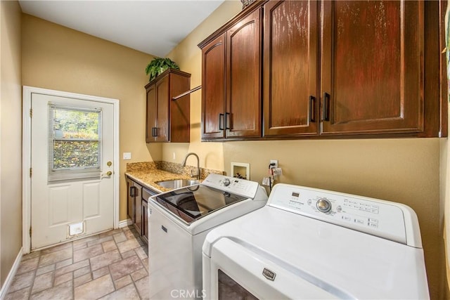 652 Fairway Dr, Redlands, CA 92373 - laundry room with cabinet space, washing machine and clothes dryer, baseboards, and light stone finish floors