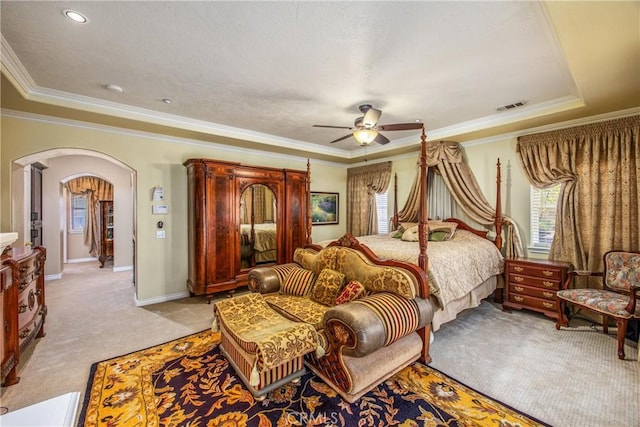 652 Fairway Dr, Redlands, CA 92373 - bedroom with arched walkways, light colored carpet, crown molding, baseboards, and ceiling fan