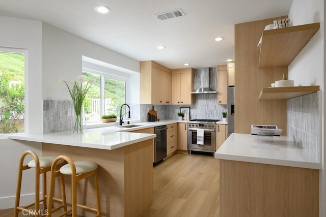 24411 Kings Vw, Laguna Niguel, CA 92677 - kitchen with visible vents, wall chimney range hood, a sink, high end range, and dishwasher