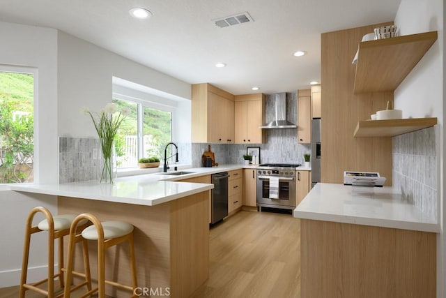 24411 Kings Vw, Laguna Niguel, CA 92677 - kitchen featuring wall chimney range hood, stainless steel appliances, a peninsula, tasteful backsplash, and recessed lighting