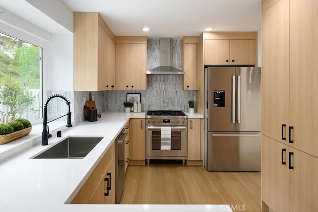 24411 Kings Vw, Laguna Niguel, CA 92677 - kitchen with appliances with stainless steel finishes, wall chimney range hood, light brown cabinets, light wood-style floors, and recessed lighting