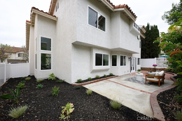 24411 Kings Vw, Laguna Niguel, CA 92677 - back of house with stucco siding, a fenced backyard, and a tile roof