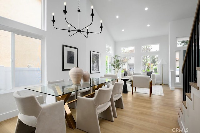 24411 Kings Vw, Laguna Niguel, CA 92677 - dining room featuring stairs, high vaulted ceiling, recessed lighting, a chandelier, and light wood-style flooring