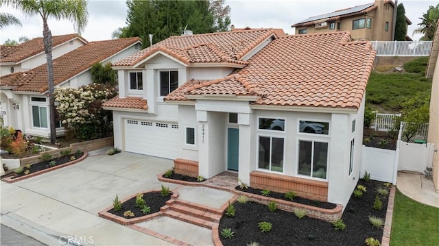 24411 Kings Vw, Laguna Niguel, CA 92677 - mediterranean / spanish-style home with fence, concrete driveway, and a tile roof