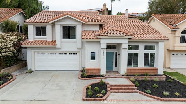 24411 Kings Vw, Laguna Niguel, CA 92677 - mediterranean / spanish home with a garage, stucco siding, a tiled roof, and concrete driveway