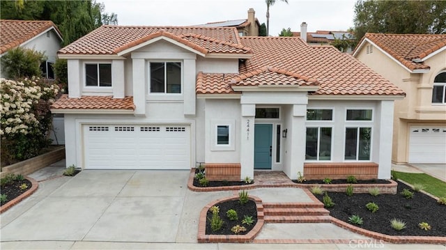 24411 Kings Vw, Laguna Niguel, CA 92677 - mediterranean / spanish home featuring stucco siding, concrete driveway, a tiled roof, and an attached garage