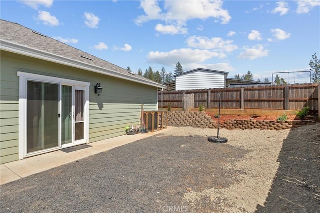 view of yard with a patio and a fenced backyard