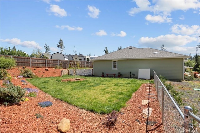 view of yard with a fenced backyard